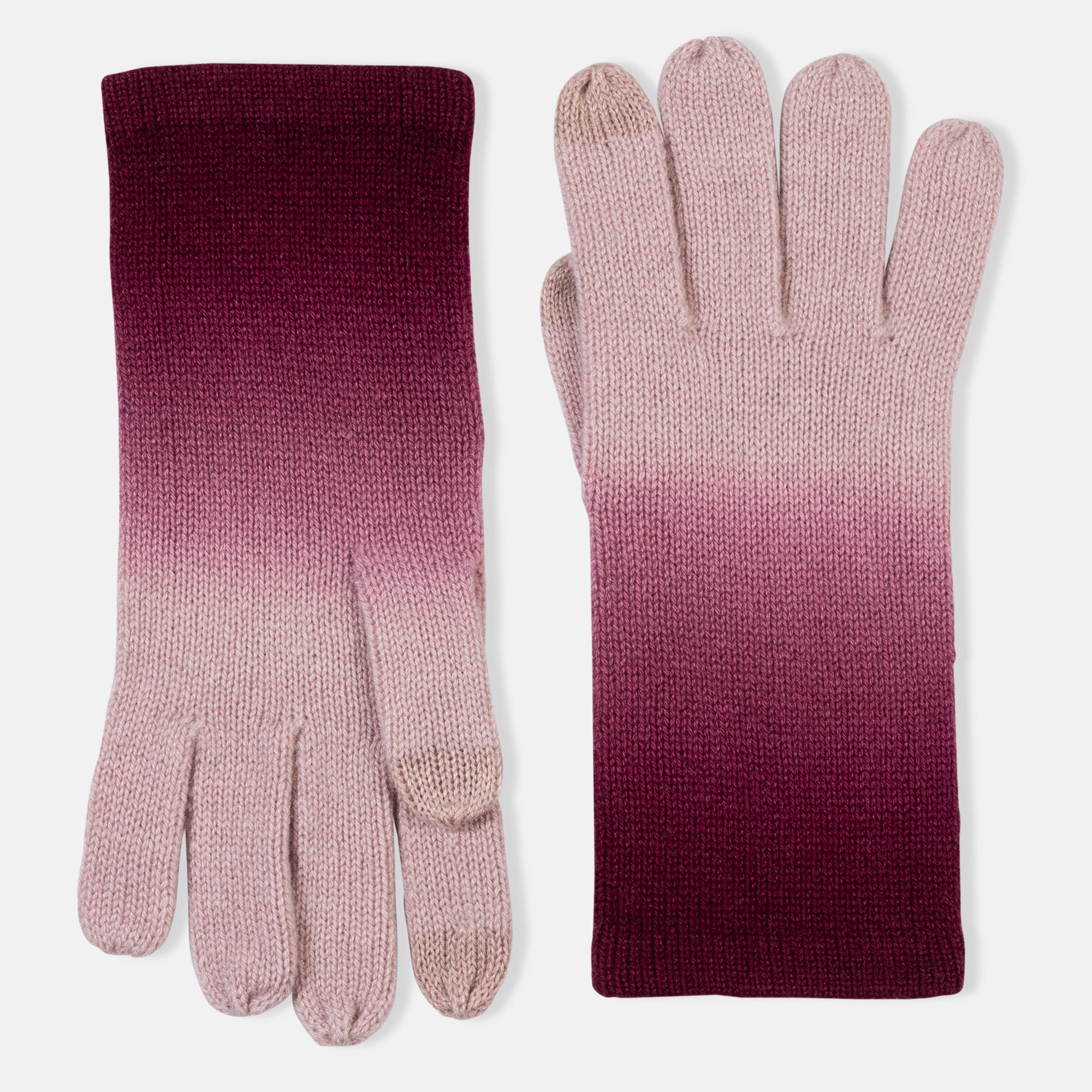 Picture of knitted cashmere gloves with tough tech at the thumb and pointer, in an ombre design of pink and burgundy.