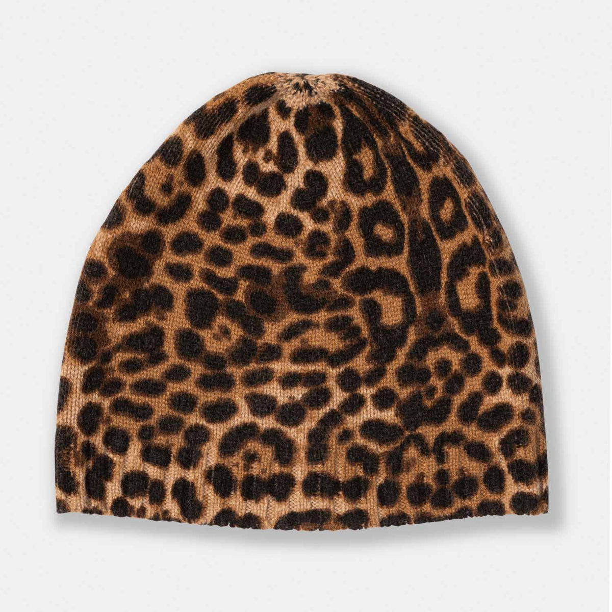 Picture of a woman wearing a leopard print cashmere beanie, gray and black.