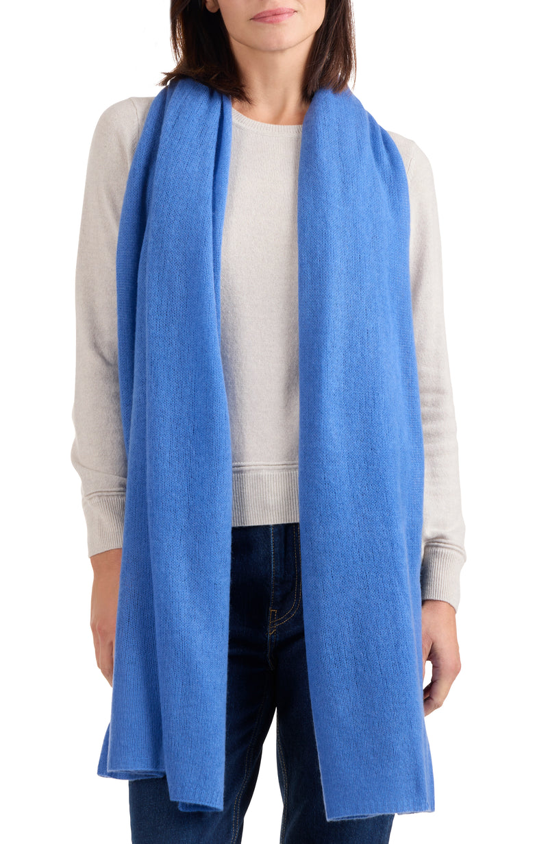 model wearing CASHMERE FEATHER WEIGHT TRAVEL WRAP in medium blue