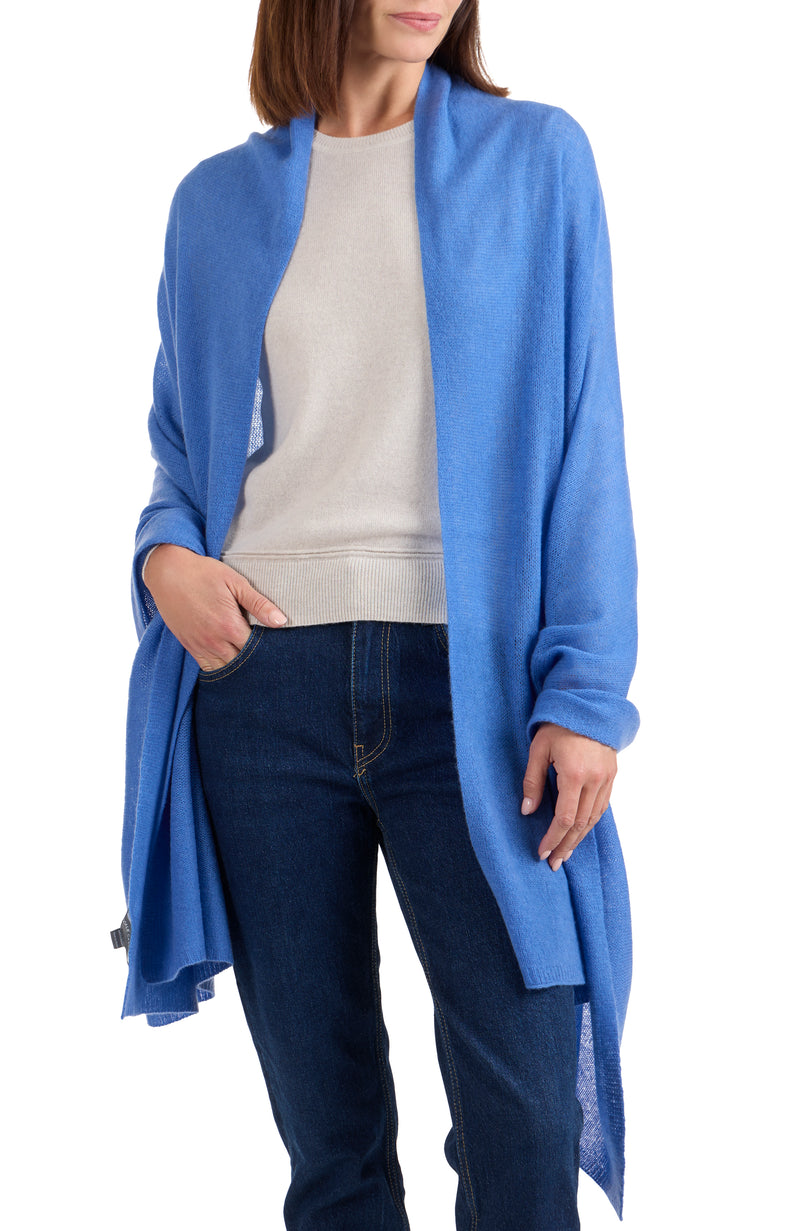 model wearing CASHMERE FEATHER WEIGHT TRAVEL WRAP in medium blue