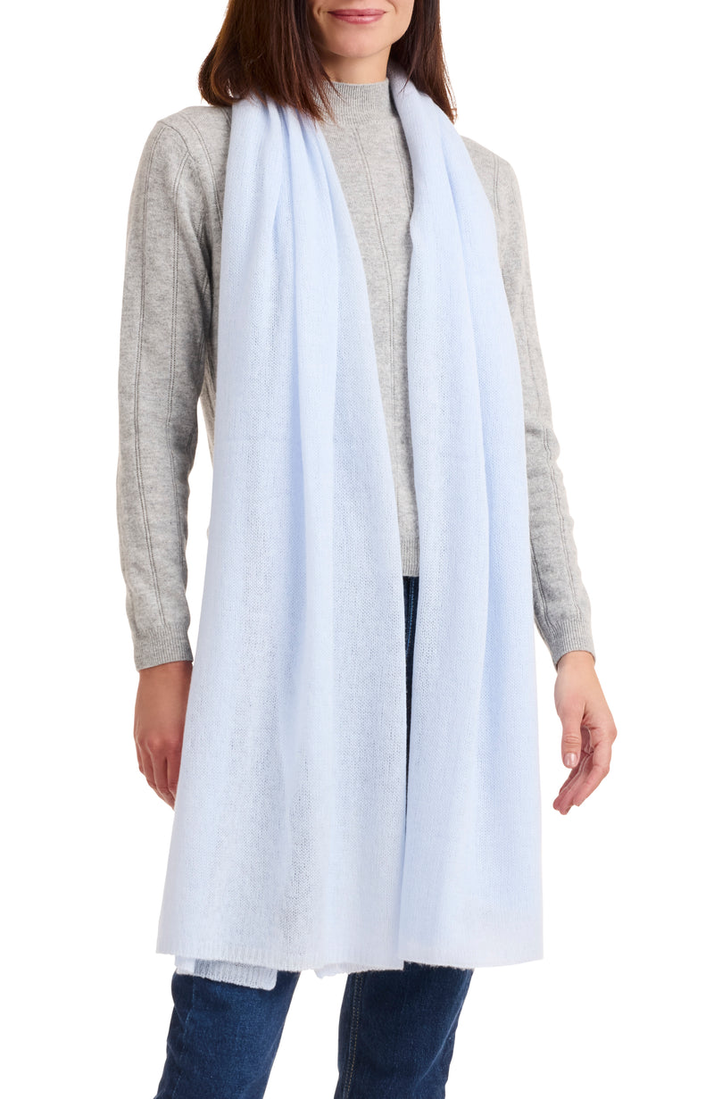 model wearing CASHMERE FEATHER WEIGHT TRAVEL WRAP in light blue
