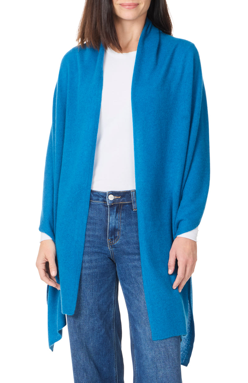 model wearing cashmere travel wrap in seaport