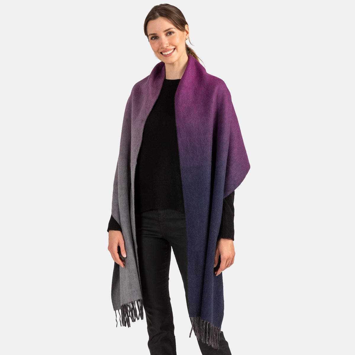 Picture of a woman wearing a double face, long woven blend wrap with fringe,in a purple and grey ombre design.