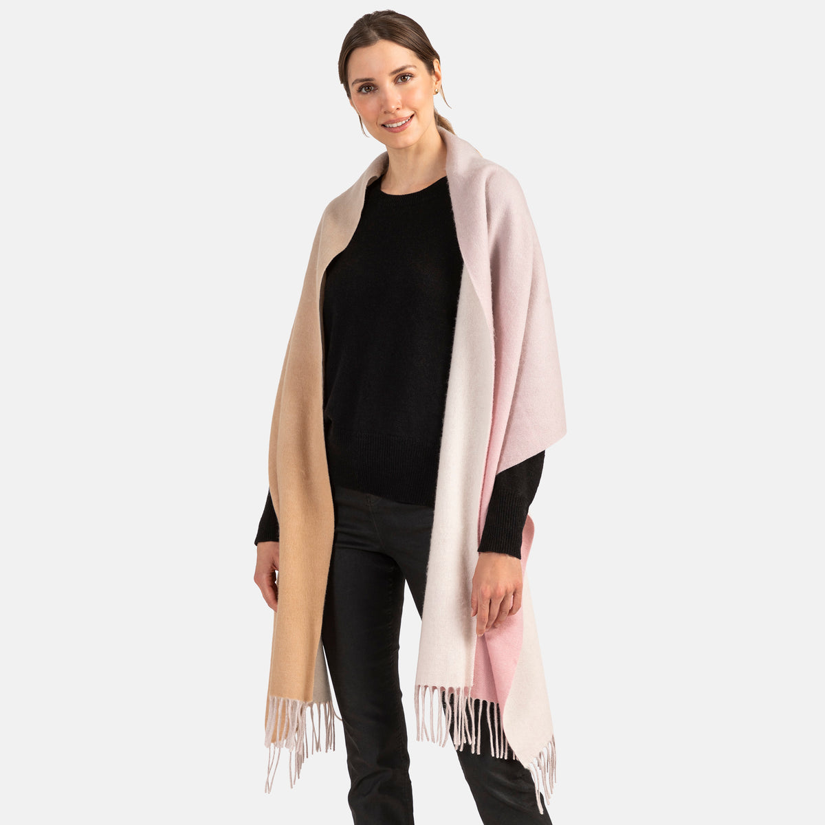 Picture of a woman wearing a double face, long woven blend wrap with fringe,in a pink and camel ombre design.