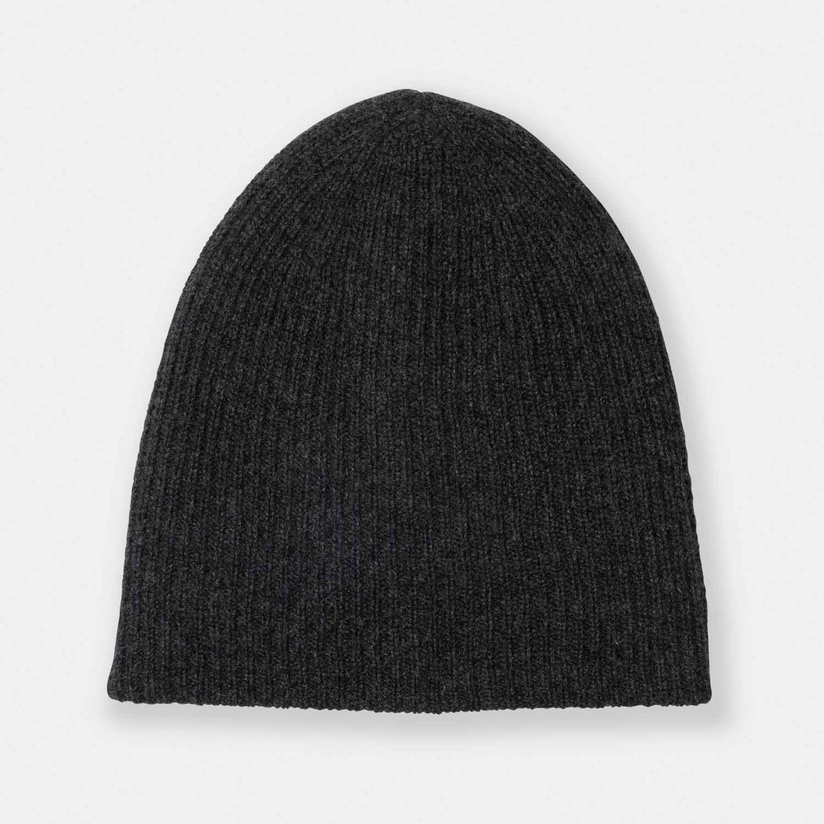Picture of a woman wearing a double layer rib knit hat in navy.