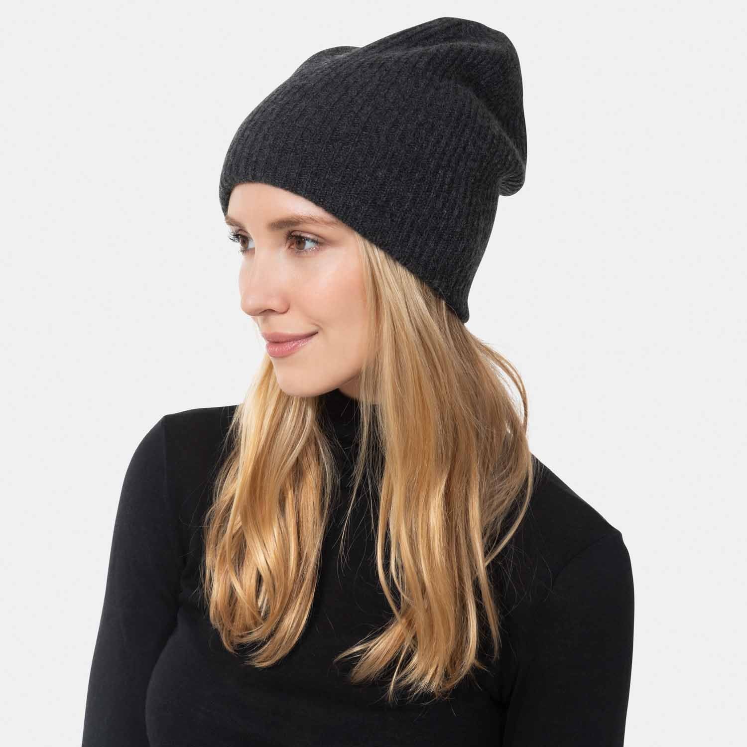 Picture of a wonan wearing a double layer rib knit hat in black.