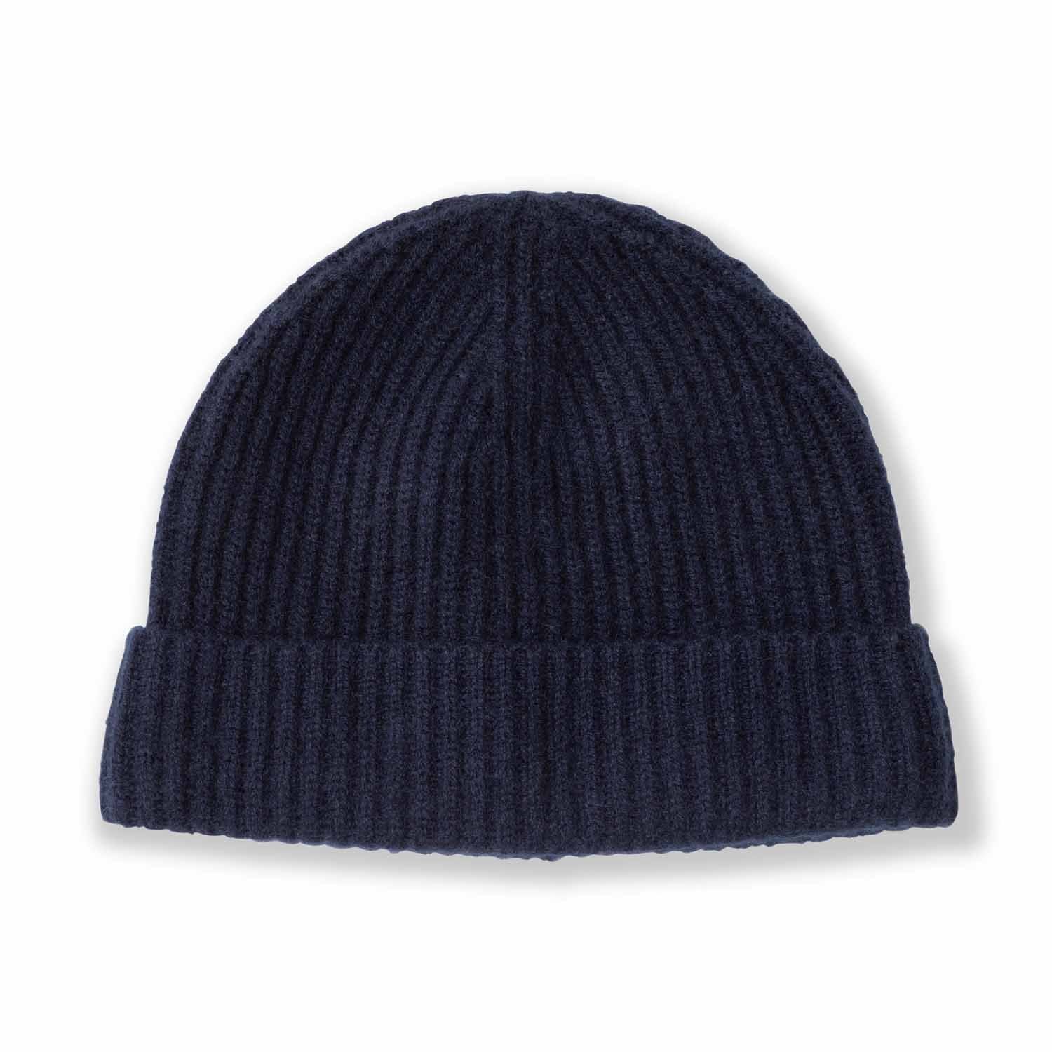 Picture of a man wearing acashmere cardigan rib knit hat in navy.